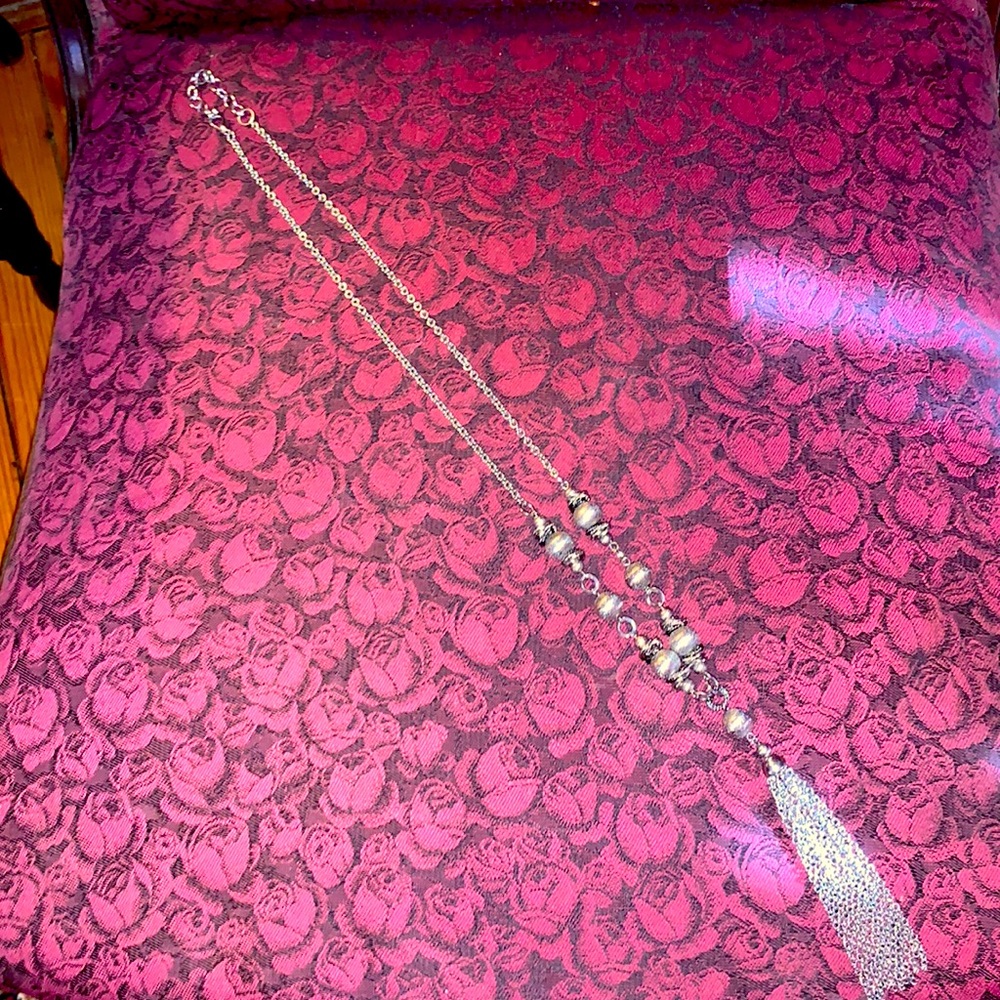 New silver long necklace with tassel.